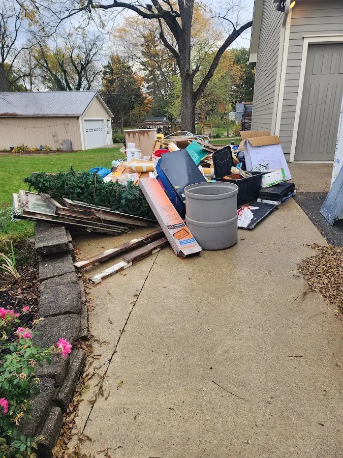 Dumpster being loaded with debris for Commercial Dumpster Rental in Semmes